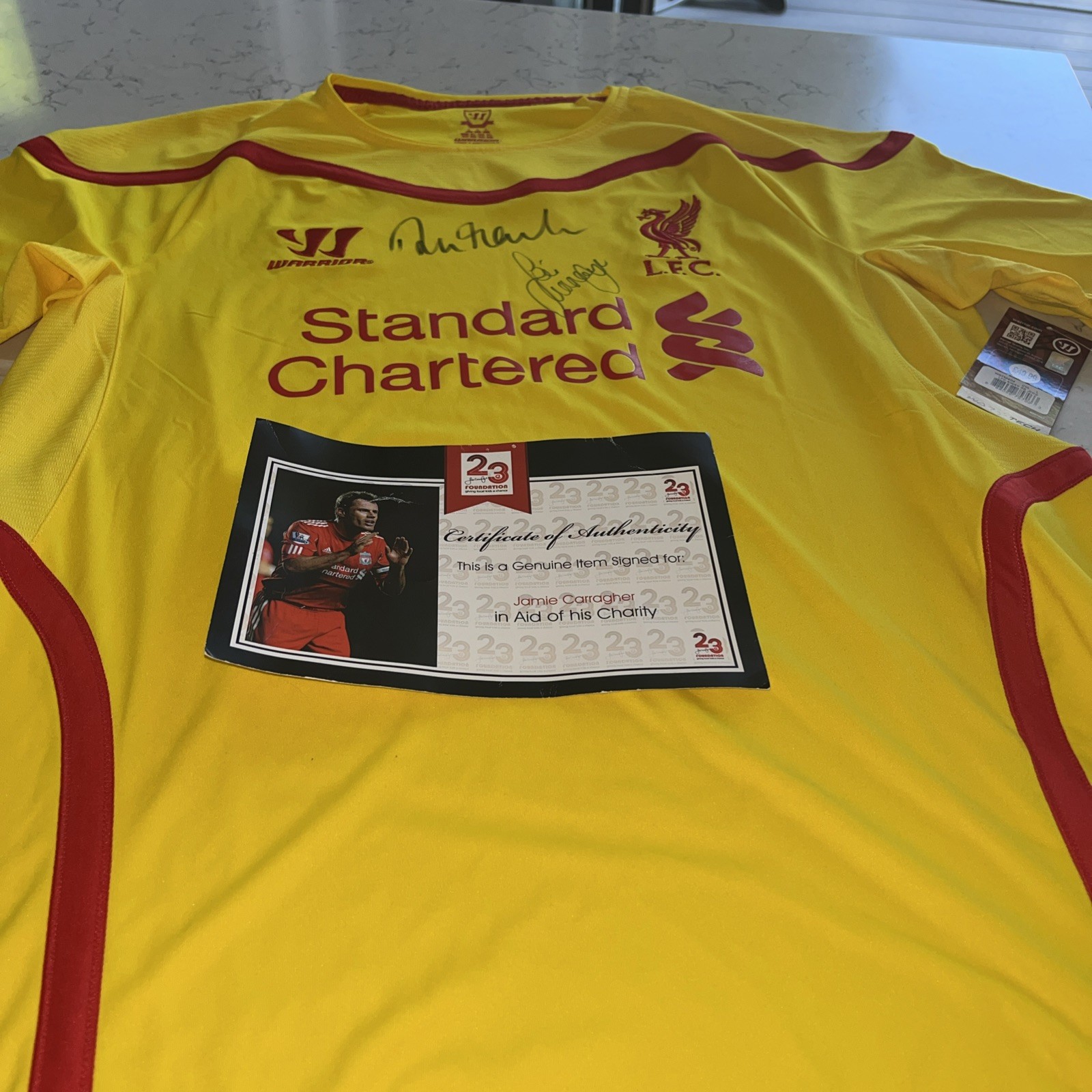 Jamie Carragher + 1 other Hand Signed Liverpool Standard Chartered Charity Shirt for sale on Ebay