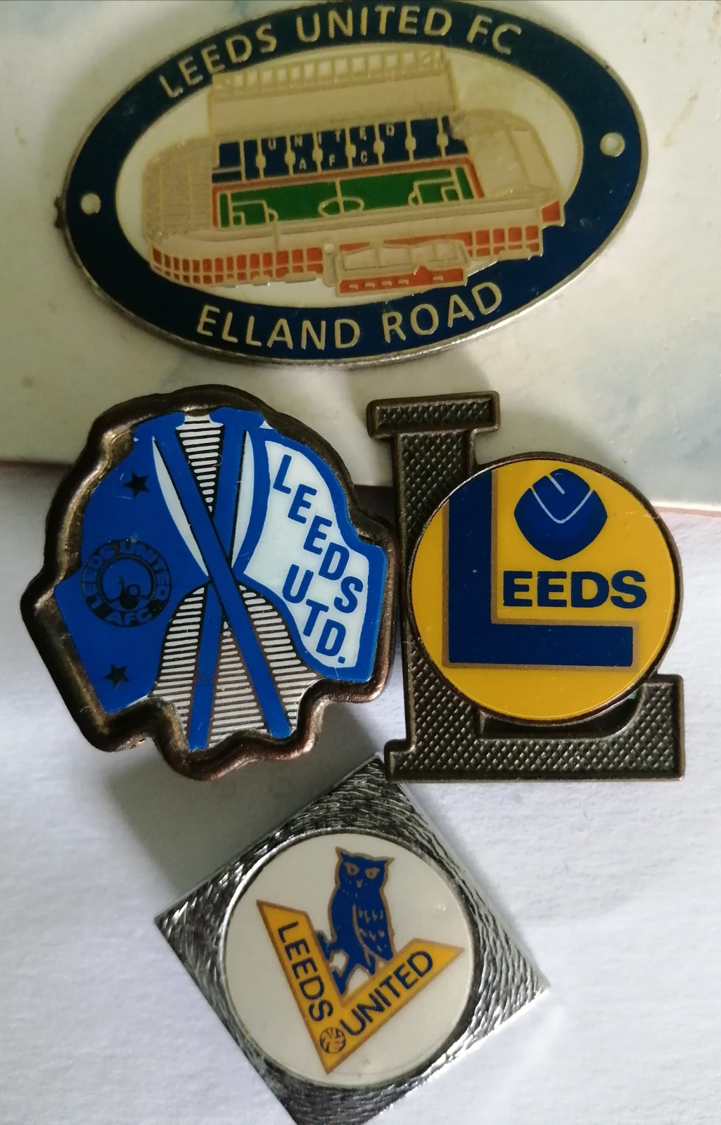 Three Leeds United  pin badges PLUS extra free item  for sale on Ebay