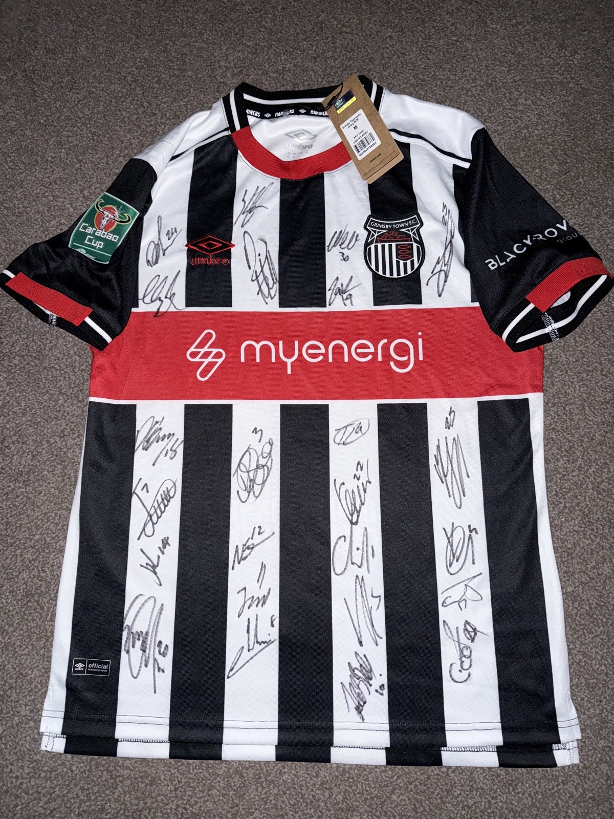 SIGNED GRIMSBY TOWN SHIRT 25/26 CARABAO CUP MANCHESTER UNITED PROOF SIGNED BY 25 for sale on Ebay