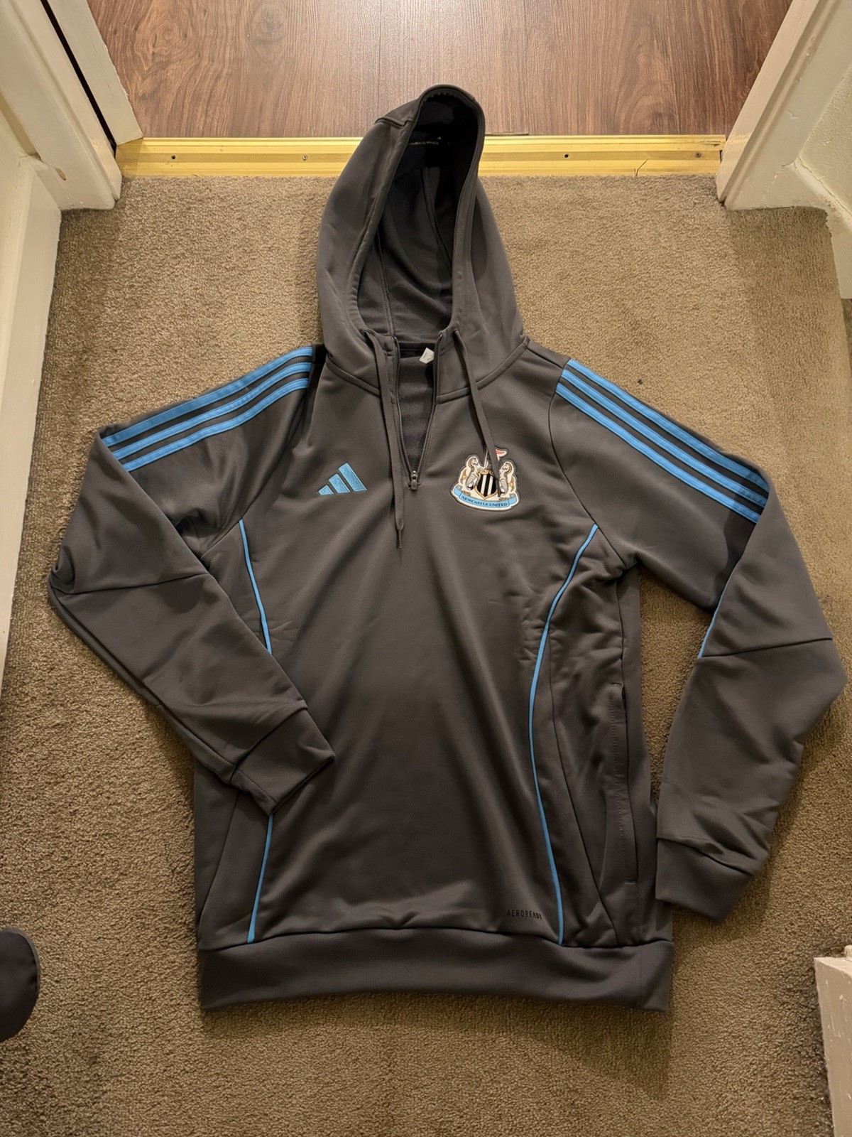 Newcastle United adidas 25/26 Players Range Grey 1/4 Zip Hooded Training Top for sale on Ebay